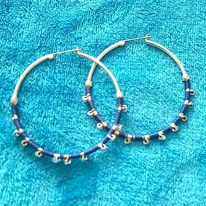 Silver toned hook earrings with blue and silver beads